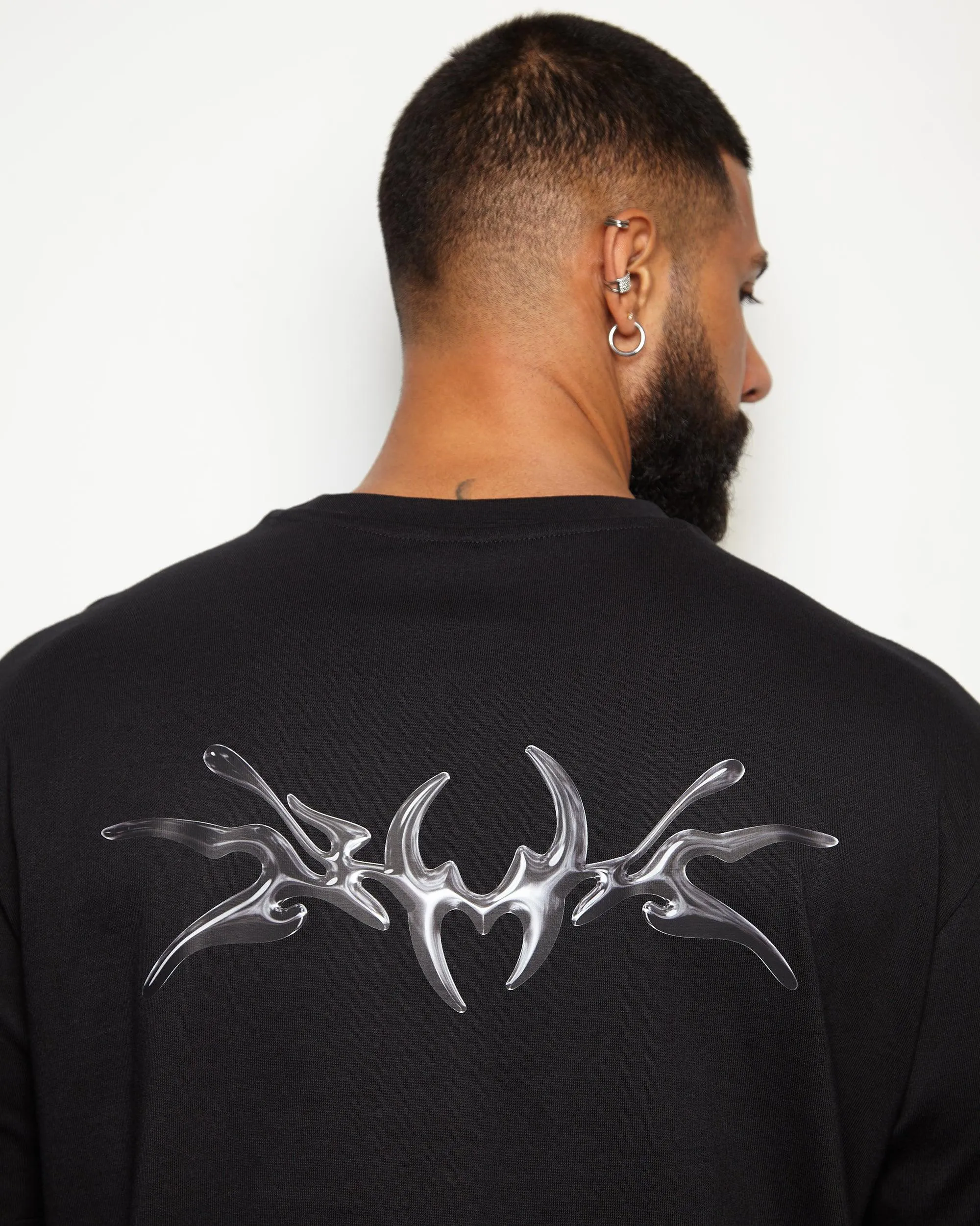 NXS001: Gunmetal style print on black heavy weight oversized tee.