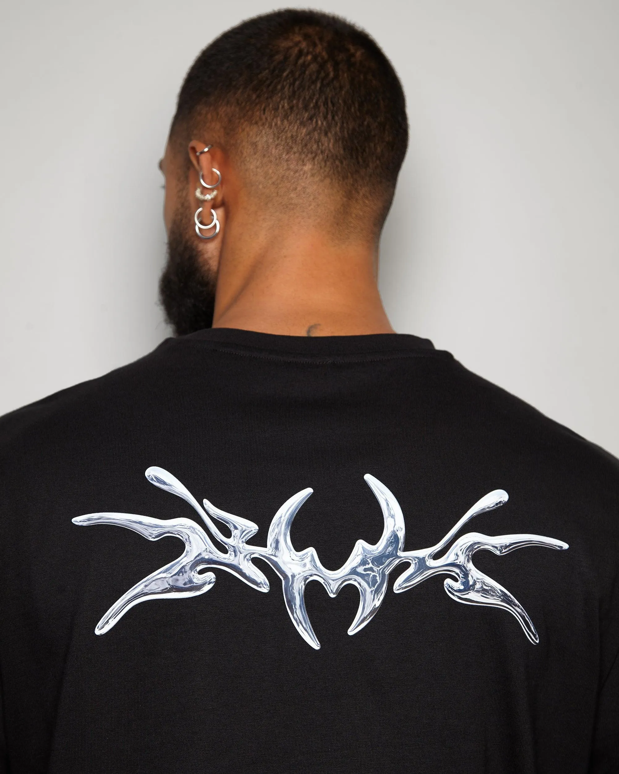 NXS008: Silver style print on black heavy weight oversized tee.